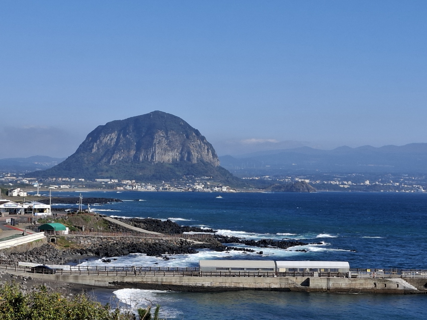 Distant view of Mount Sanbangsan, a solitary volcanic dome rising from the southwestern landscape of Jeju Island